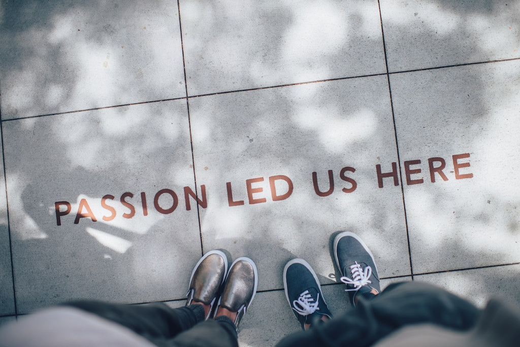 "Passion led us here" creative quote stamped on pavement
