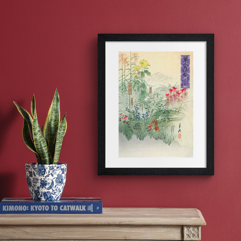 Japanese vintage art print hung up on a red wall.