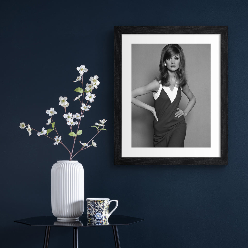 Photography art print of Jean Shrimpton hung up on a blue wall.
