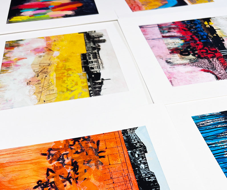 Abstract art prints laid down on a table.