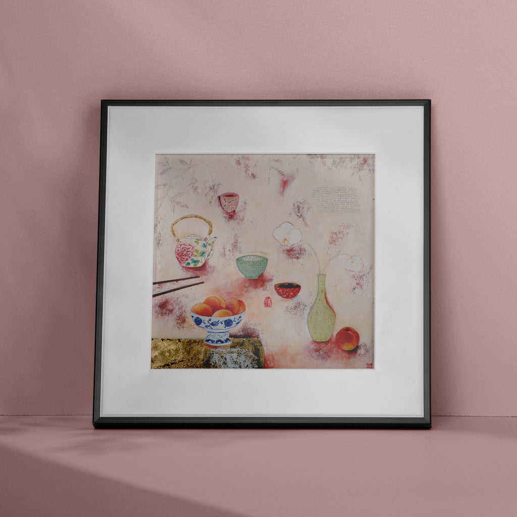 Cosy abstract print containing a food spread of peaches and tea, laid out on a pink background. Art print is leaning against a pink wall.