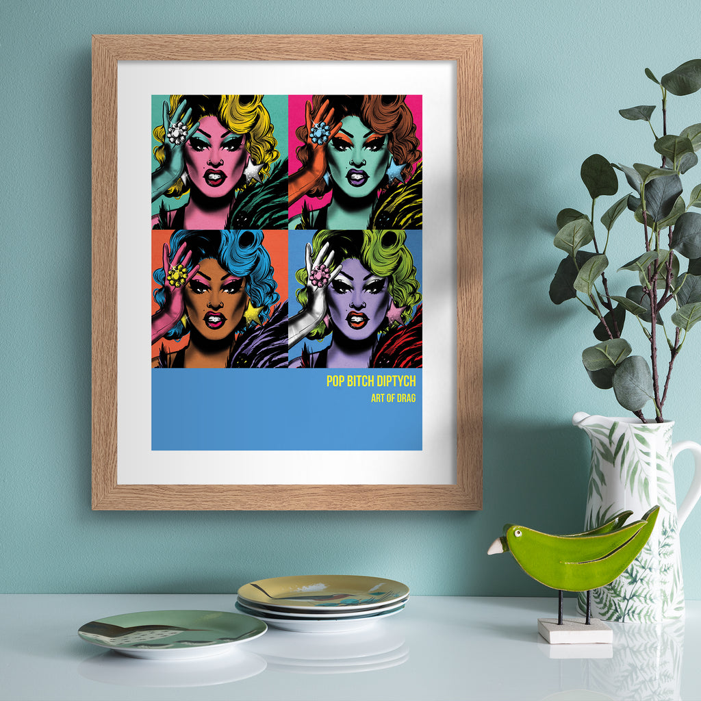 Reimagined art print featuring a Drag Queen in 'pop art' style, in four colourways, hung up on a blue wall.