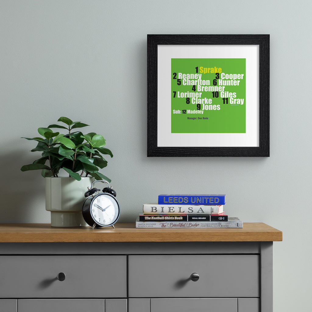 Art print featuring typography celebrating Leeds 1968 team, on a bright green background. Art print is hung up on a grey wall.