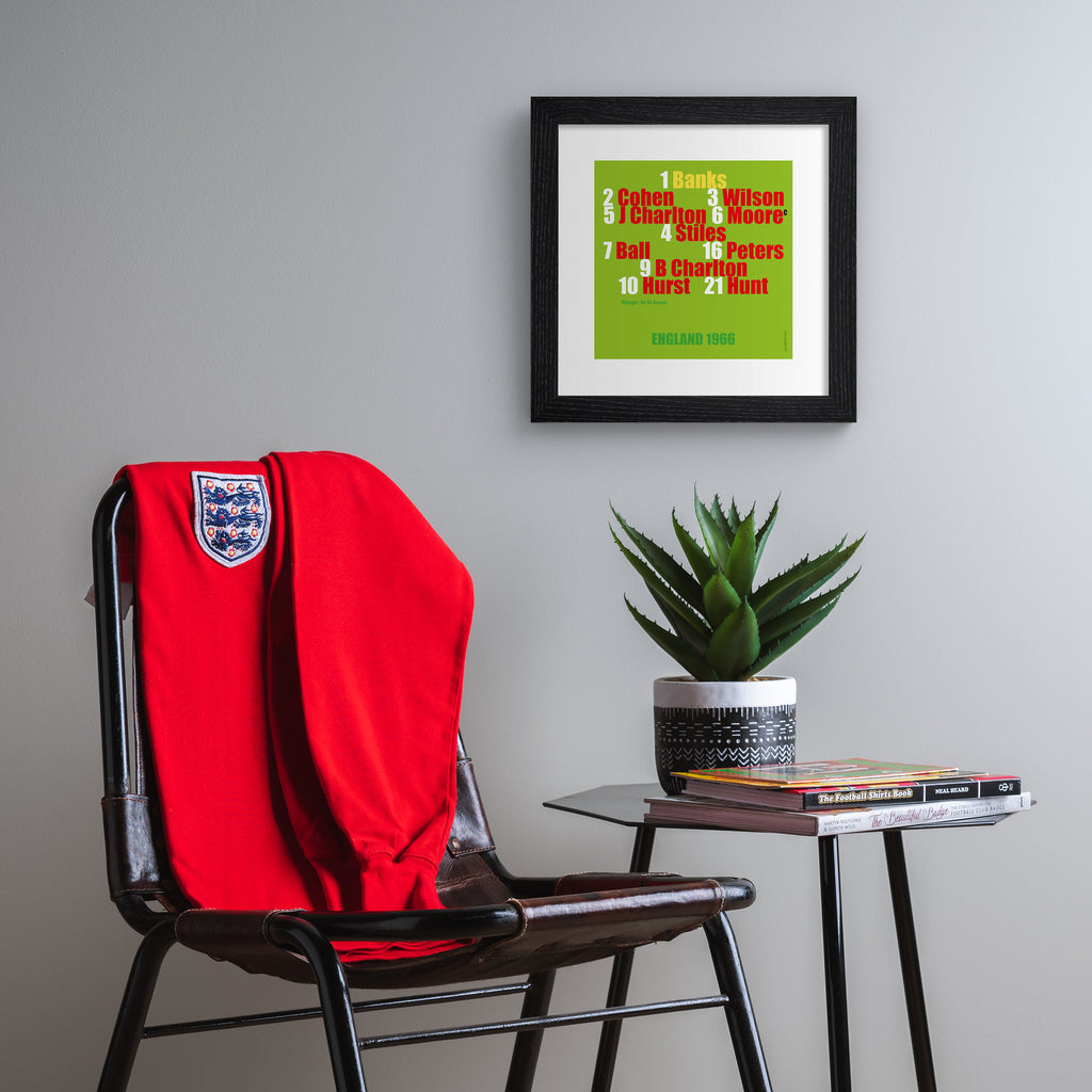 Sporty art print celebrating England football, on a bright green background, with red, white, gold and green typography. Art print is hung up on a grey wall.