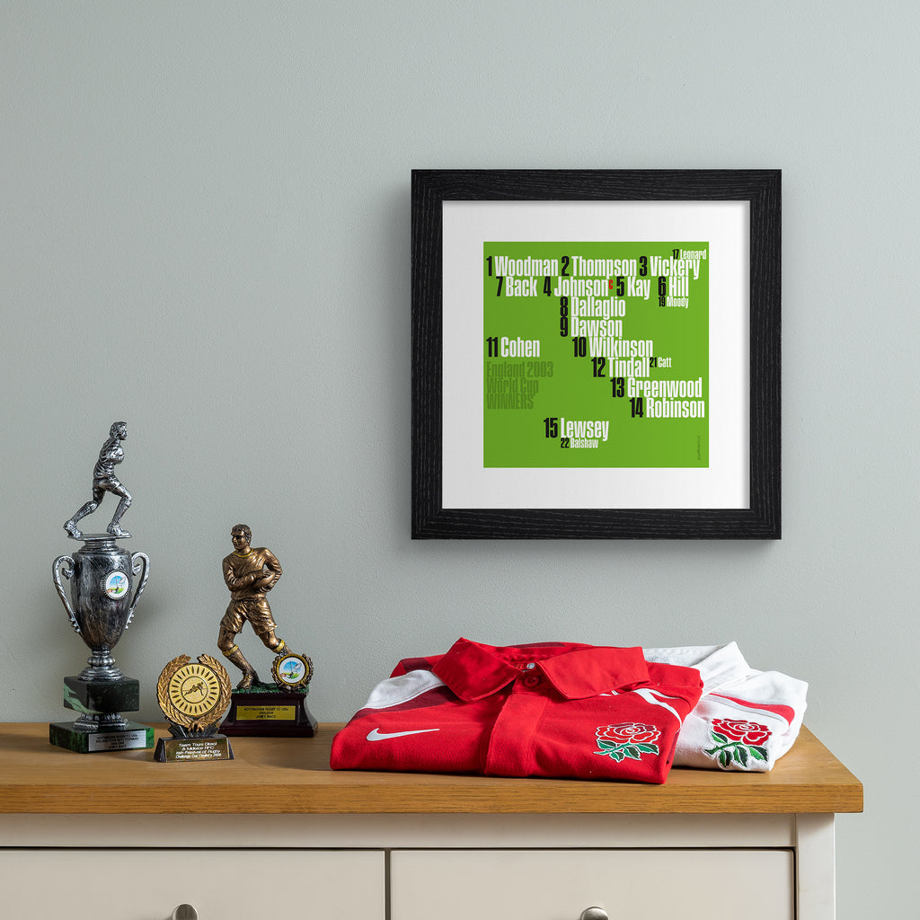 Sporty art print celebrating England rugby, on a bright green background, with white, black and green typography. Art print is hung up on a grey wall.