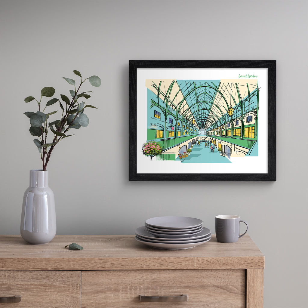 Colourful travel art print of Covent Garden in London, featuring the inside of the brightly lit building and some flowers blooming out of the frame. Text in the top right corner reads 'Covent Garden'. Art print is hung up on a grey wall.