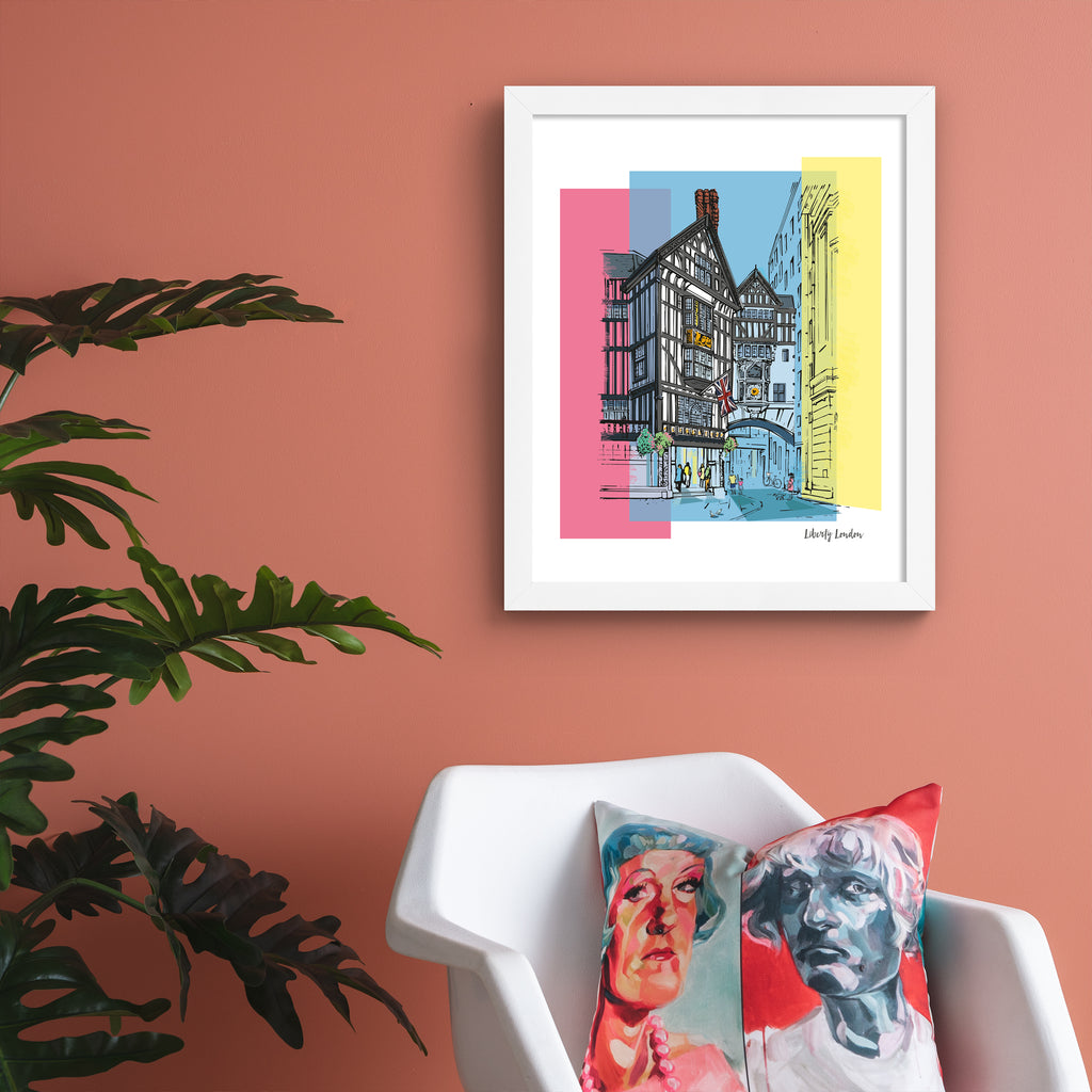 Vibrant travel art print featuring Liberty in London, amidst a brightly coloured background of pink, blue and yellow. Art print is hung up on a pink wall.