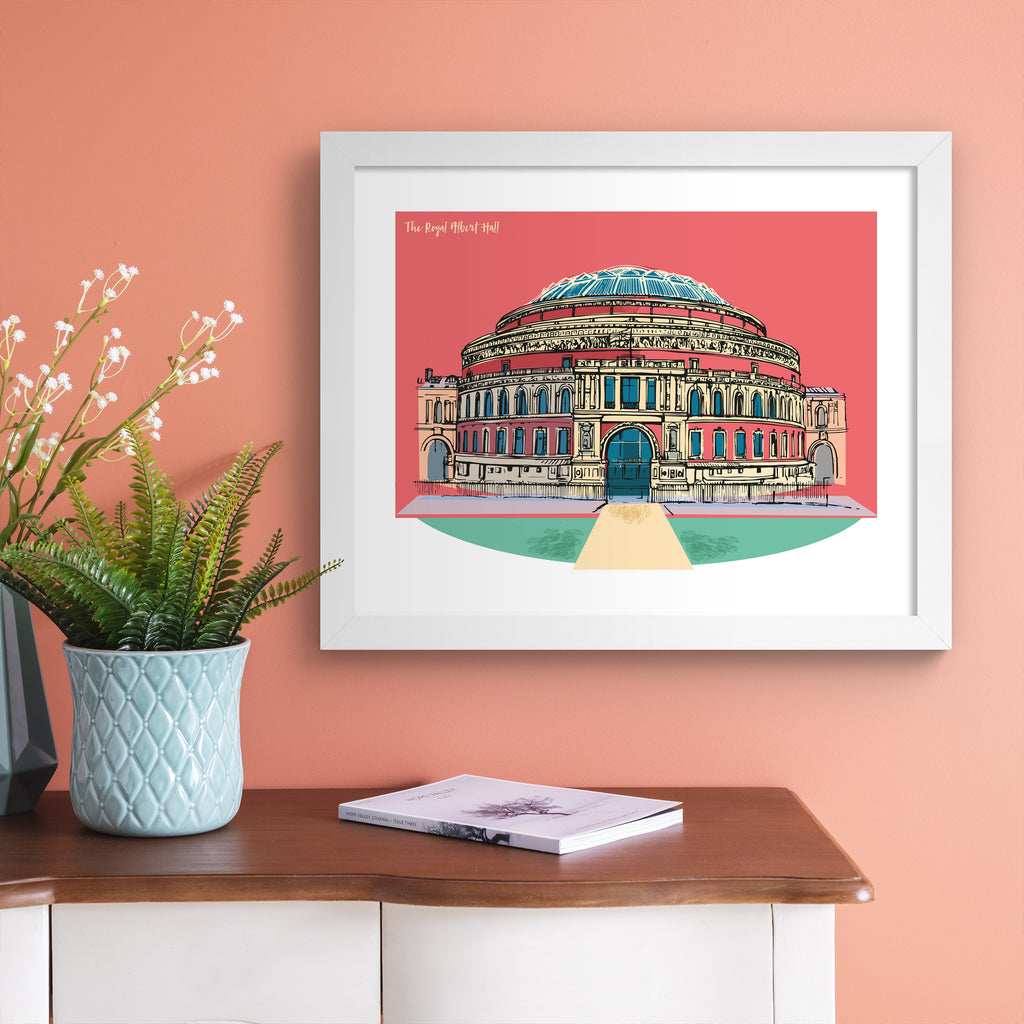 Vibrant travel art print featuring The Royal Albert Hall in London, in front of a bright pink background. Title in the top left reads ' The Royal Albert Hall'. Art print is hung up on a pink wall.