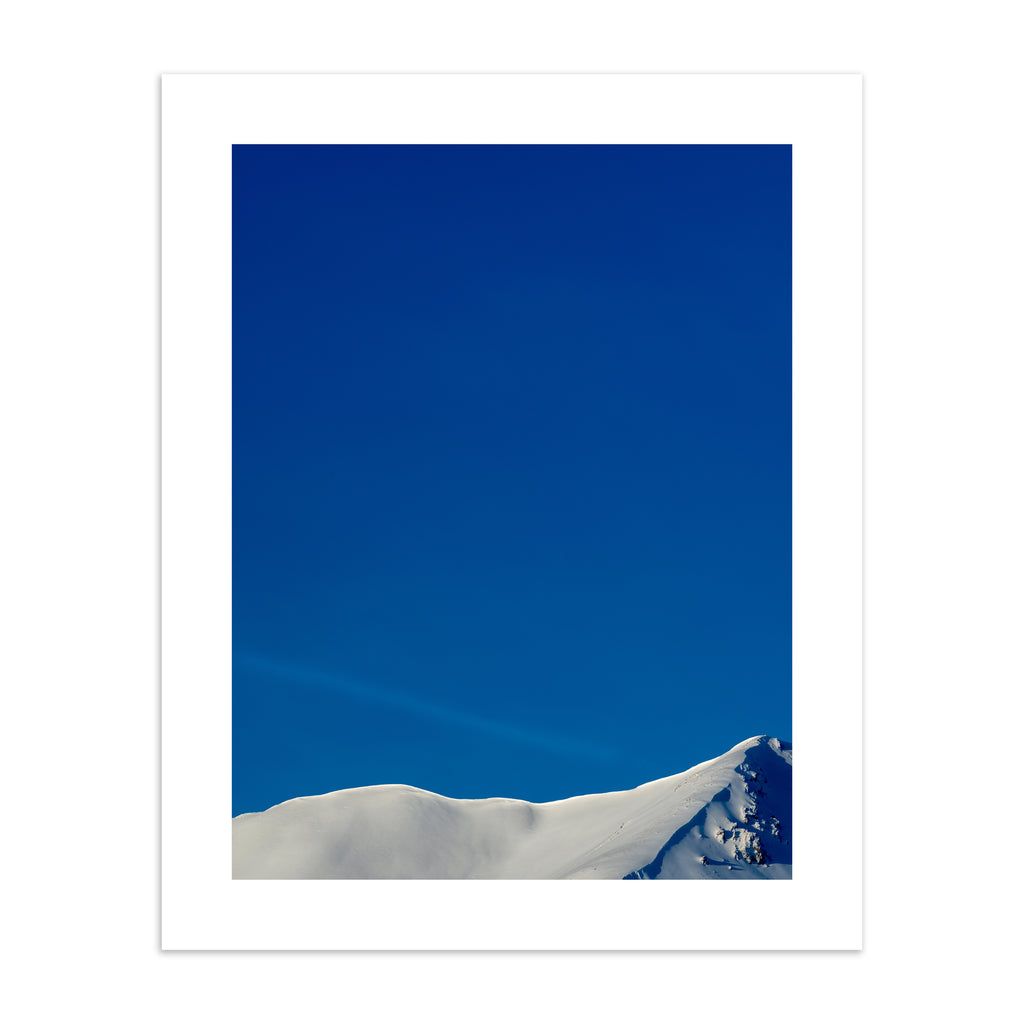 Photography art print featuring a snowy peak of Beinn Eighe, under a brilliant blue sky.