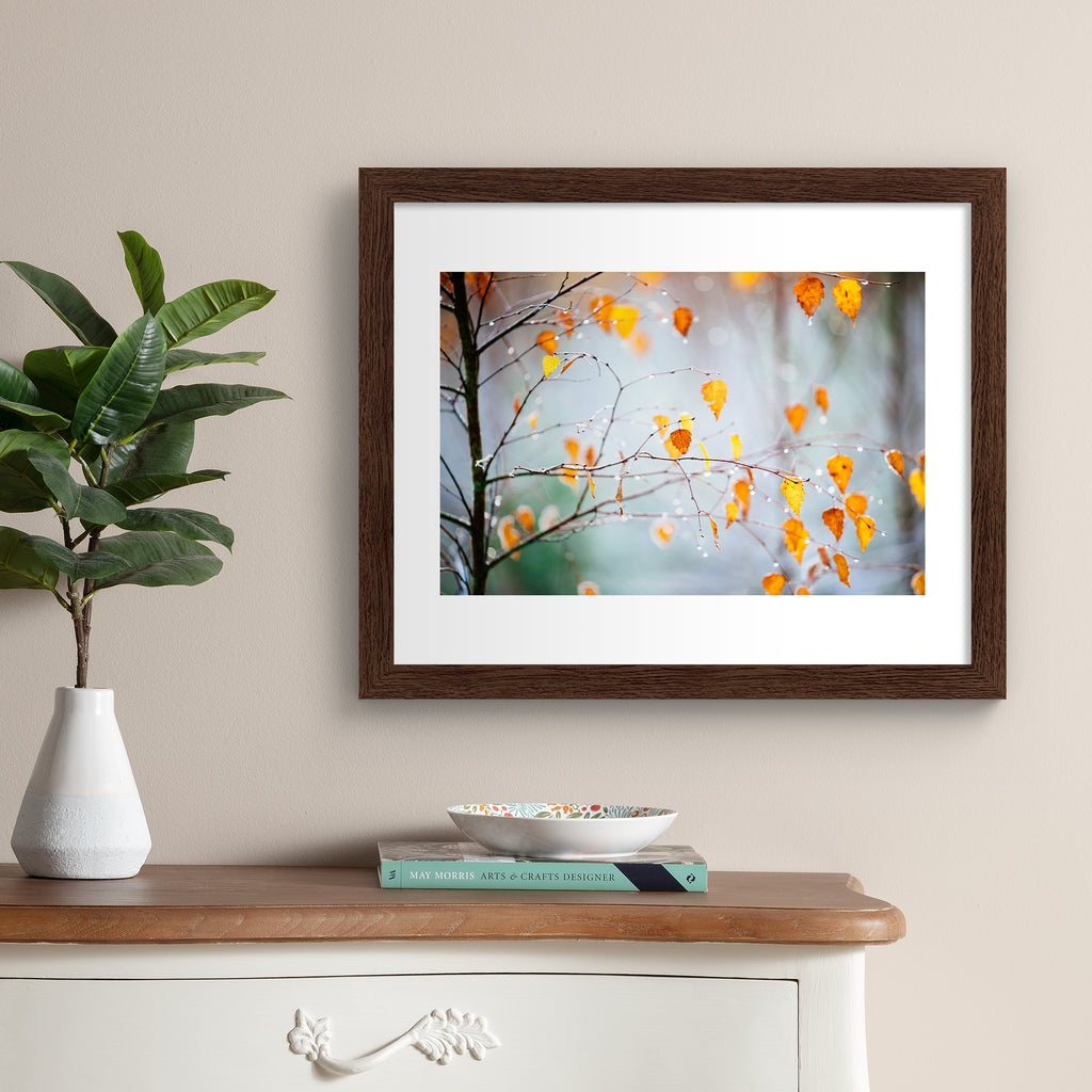 Photography art print featuring an Autumnal tree dripping with frost. Art print is hung up on a beige wall.