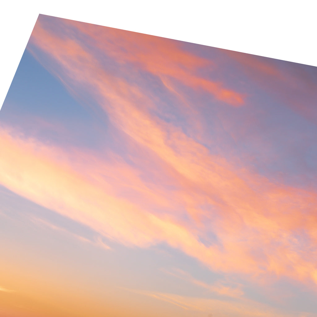 Close up of a stunning photography art print featuring a vivid sunrise over a reflective beach.