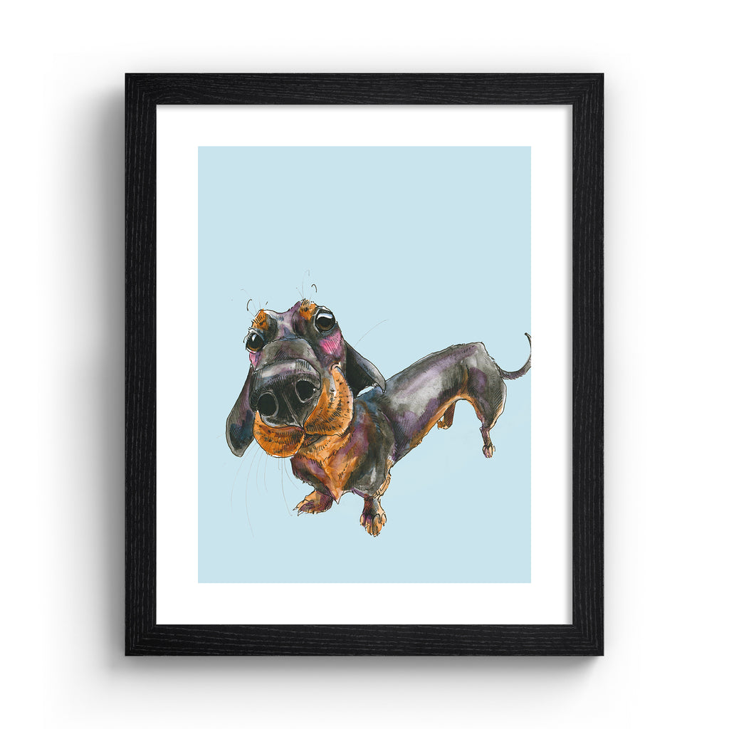 Playful art print featuring a curious dachshund dog, posing in front of a pale blue background. Art print is in a black frame.