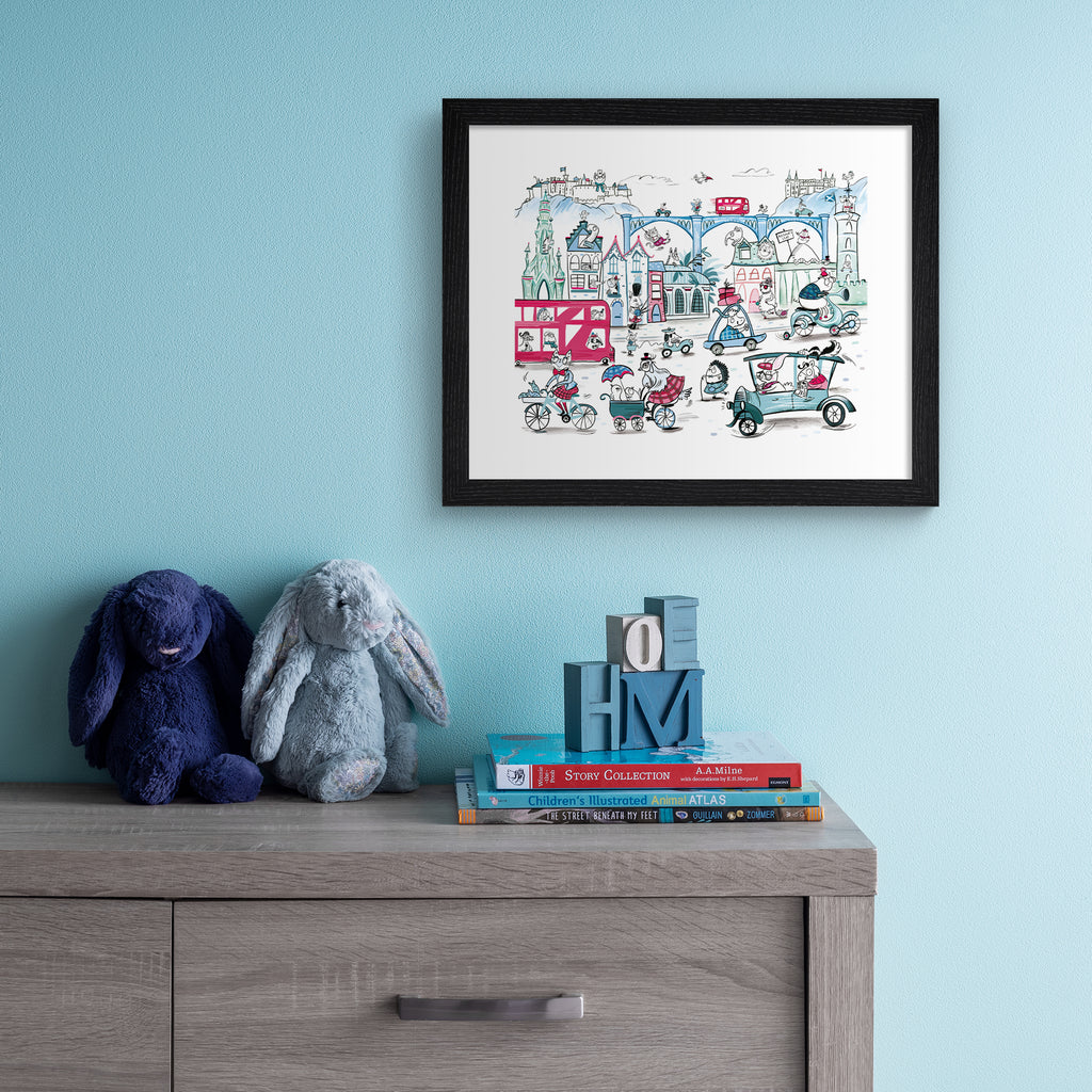 Colourful art print featuring playful animals exploring Edinburgh. Art print is hung up on a blue wall.