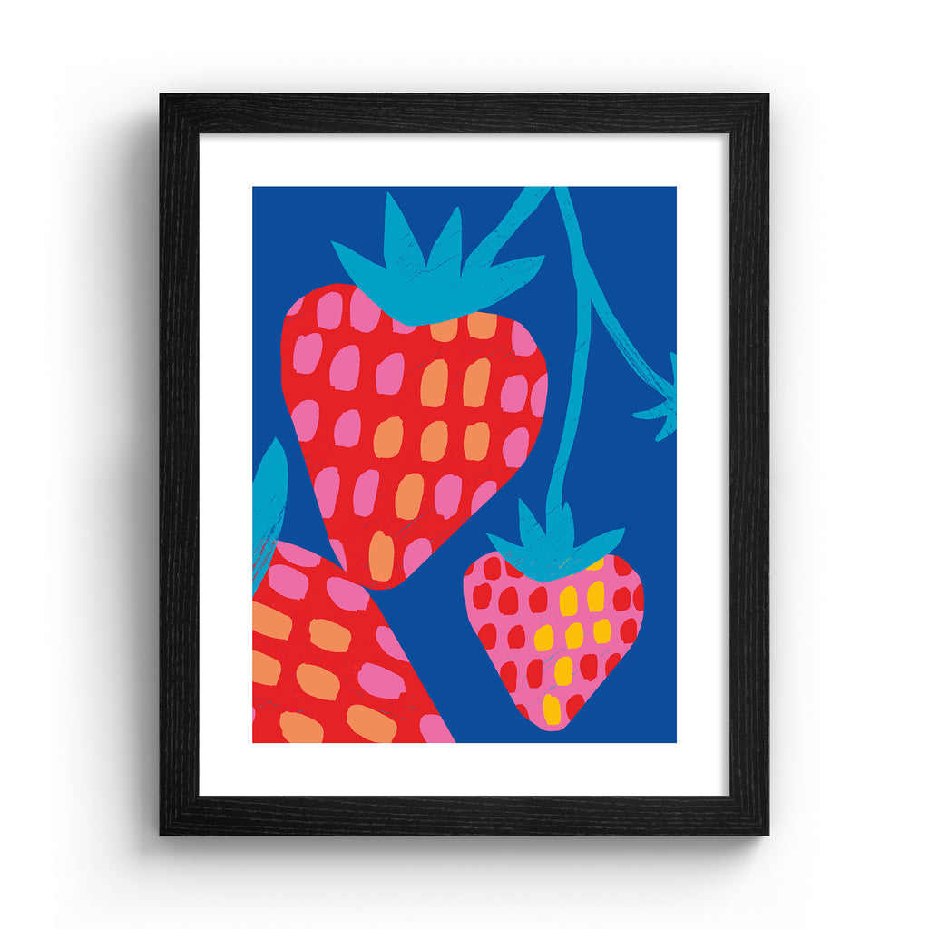 Vivid art print containing a bunch of strawberries dangling in front of a bright blue background. Art print is in a black frame.