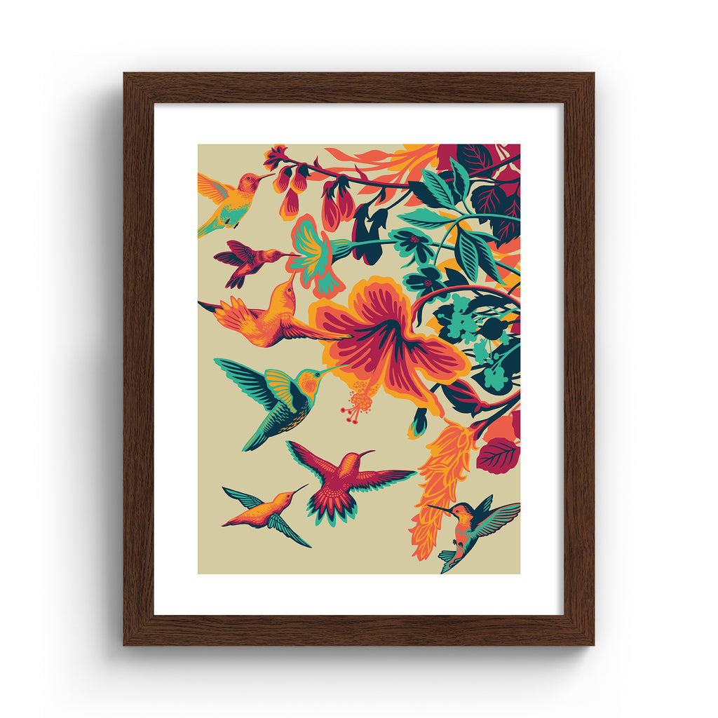 Striking art print featuring brightly coloured hummingbirds hovering above vibrant flowers.  Art print is in an oak frame.