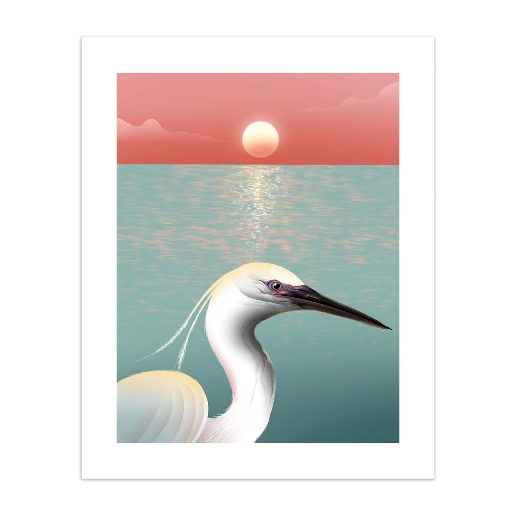 Striking art print featuring a white egret posing in from of the ocean, as the sun sets on the horizon.