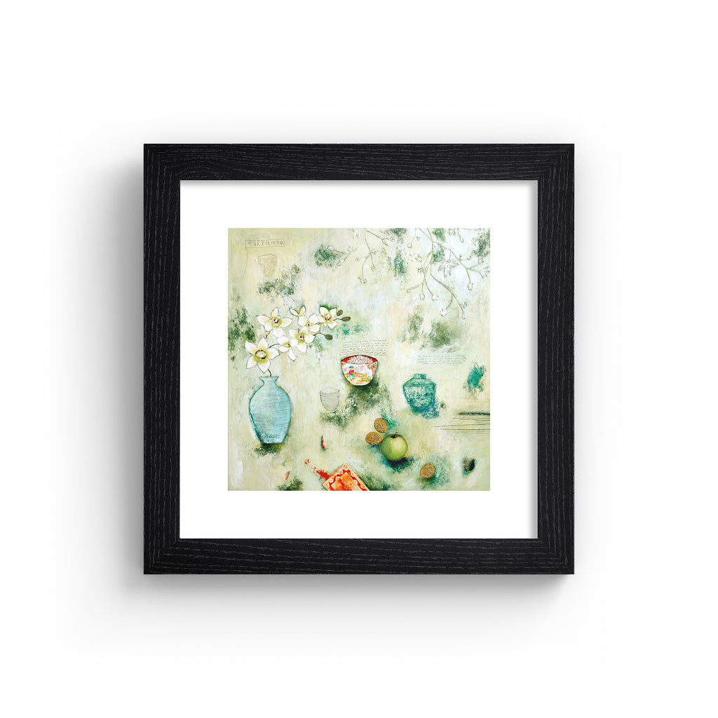 Abstract art print containing an assortment of food and household objects, laid out on a pale green background. Art print is in a black frame.