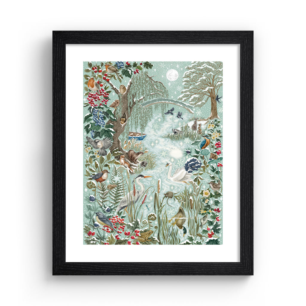 Christmas art print featuring a wintery wonderland scene of animals and botanicals basking by a river on a frosty day. Art print is in a black frame.