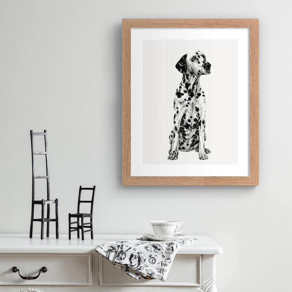Black and white illustration featuring a detailed drawing of a Dalmatian dog, hung up on a grey wall.
