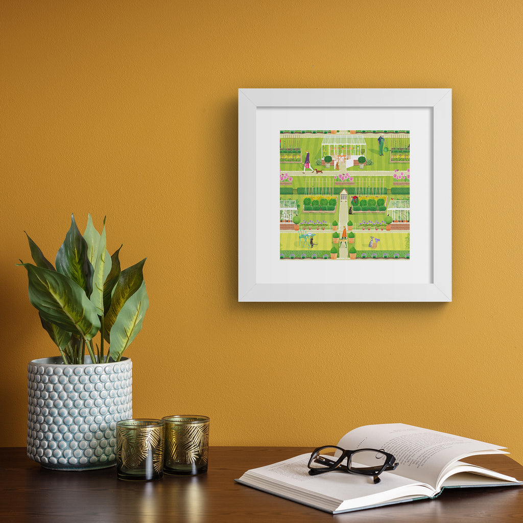 Vibrant art print featuring a symmetrical green garden, filled with a greenhouse, animals, gardeners and blooming botanicals. Art print is hung up on a deep orange wall.