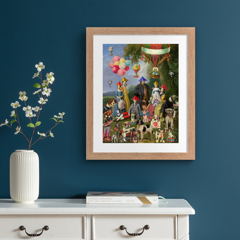 Vibrant art print featuring a 'dog picnic' of people, dogs and characters on a lawn. Art print is hung up on a blue wall.